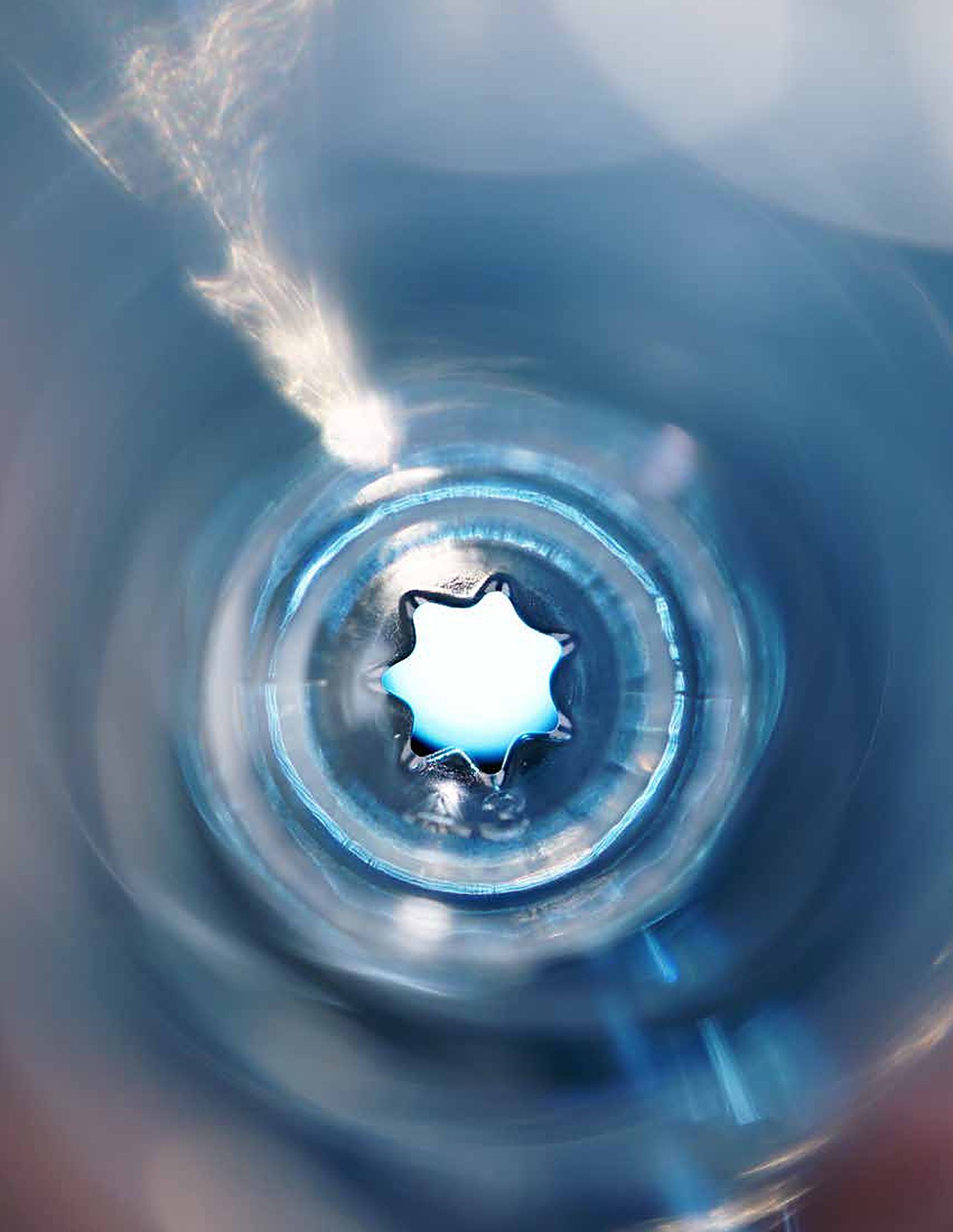 Clear blue plastic with a star-shaped opening