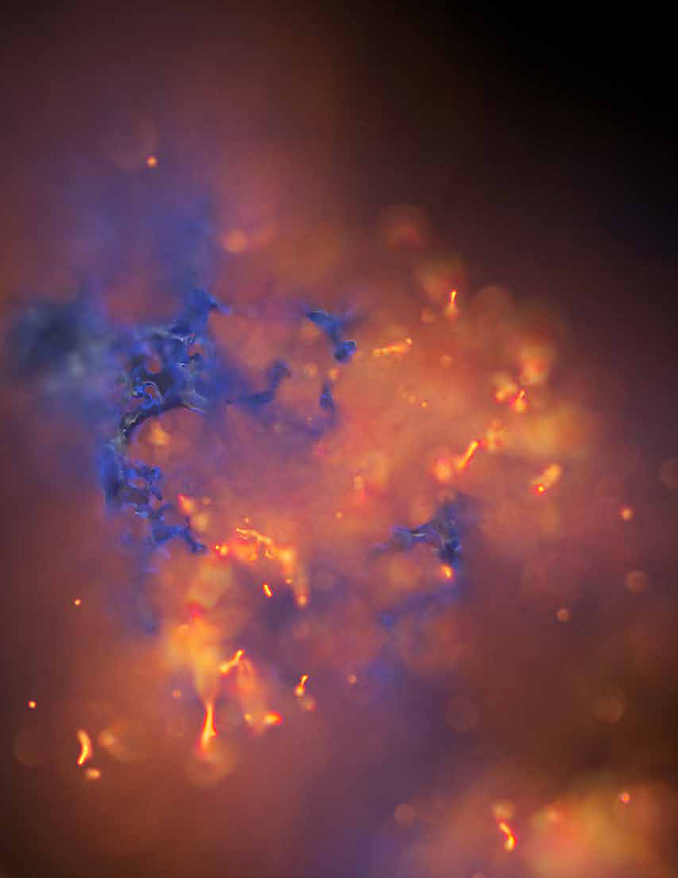 Orange and blue sparks on black